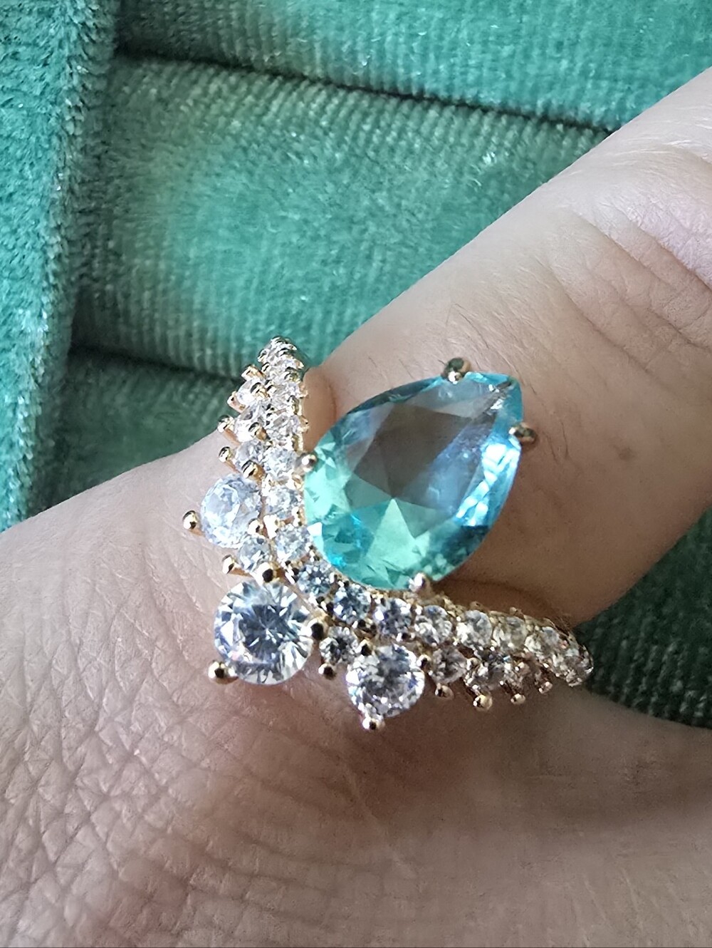 Gold Ring with Teal Pear-Cut Center and Clear Accent Stones